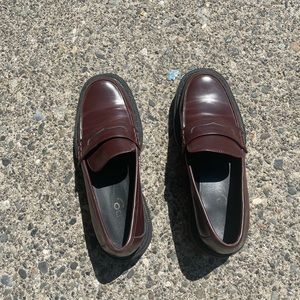 Brown and black loafers